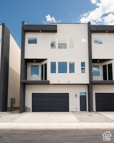 View of front of home featuring a garage