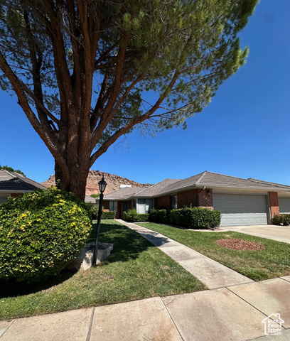 Beautiful lanscaped HOA maintained neighborhood with 2 car garage.  Front shade in the afternoon for sitting outside