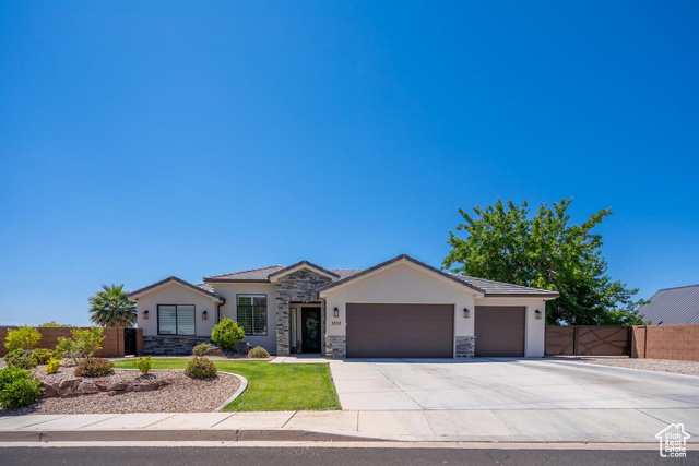 Single story home featuring a garage