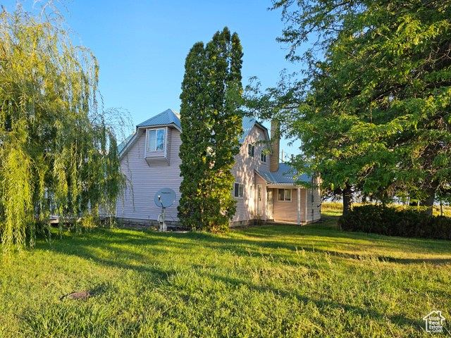 Exterior space featuring a yard