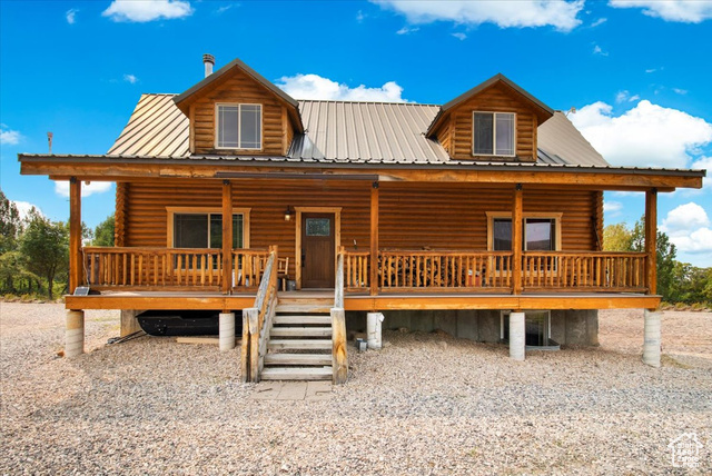 Log home with covered porch