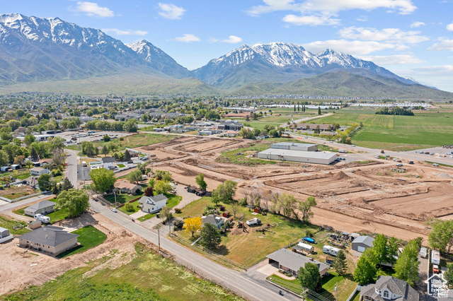 Birds eye view of property with a mountain view