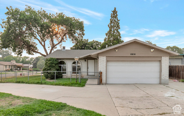 Ranch-style house with a garage