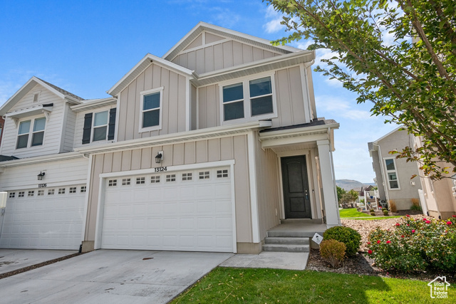 View of front of property with a garage