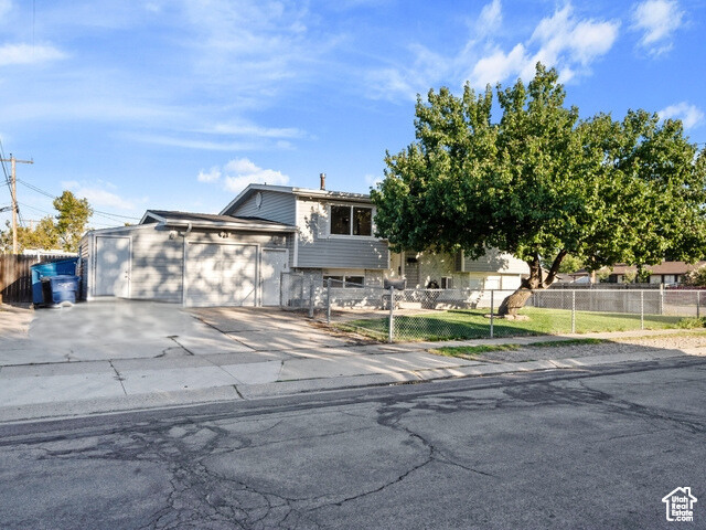 View of front of property featuring a garage