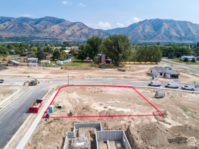 Birds eye view of property with a mountain view