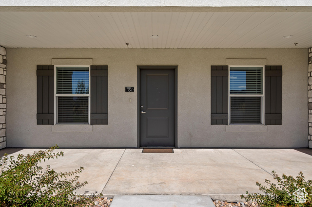 Entrance to property featuring a patio