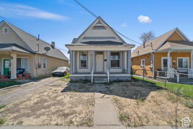 Bungalow featuring covered porch