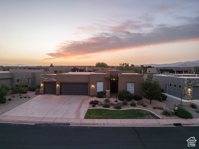 View of front of property with a garage