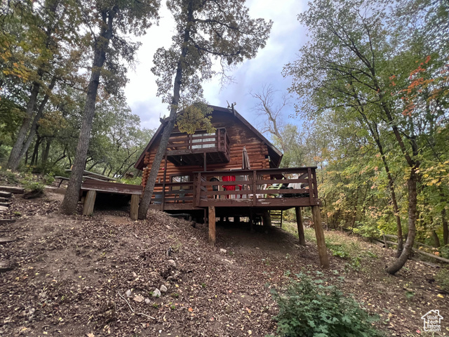 Back of house featuring a deck