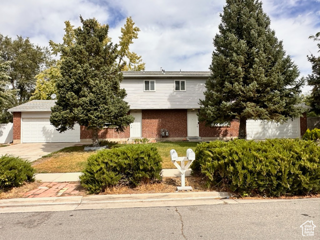 View of front of property featuring a garage