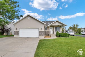 View of front of home with exrea wide garage