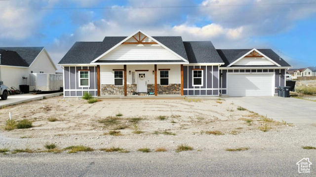 Front of home featuring Lp siding and stucco exterior