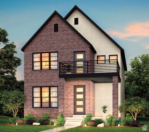 View of front of home featuring a balcony