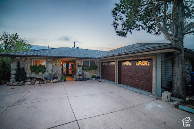 Single story home with a garage