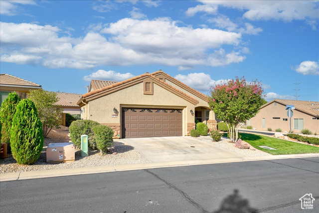 View of front of property with a garage