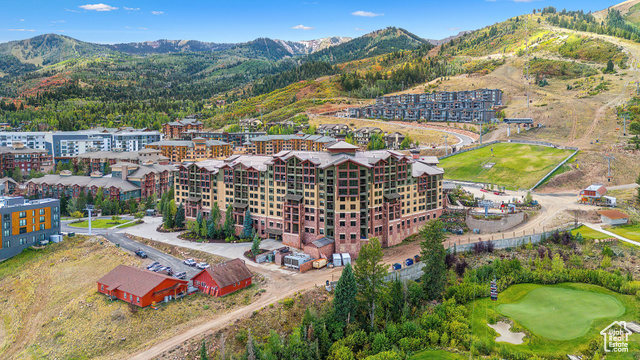 Birds eye view of property with a mountain view