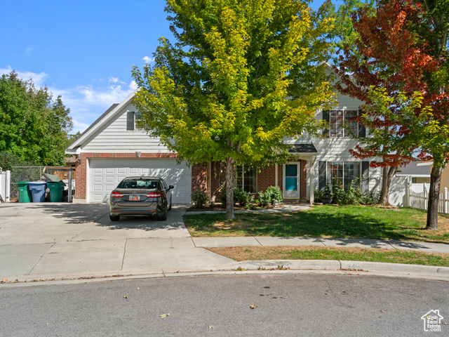 Obstructed view of property featuring a garage