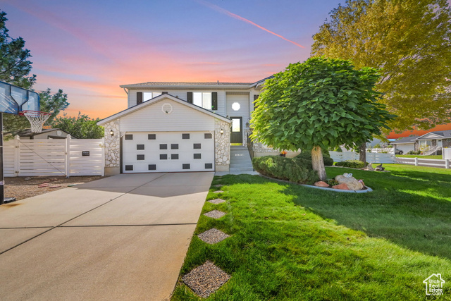 View of front of home with a lawn