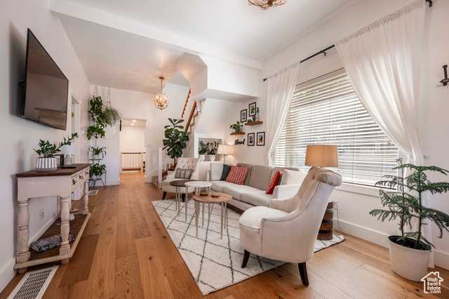 Living room featuring radiator and hardwood / wood-style floors