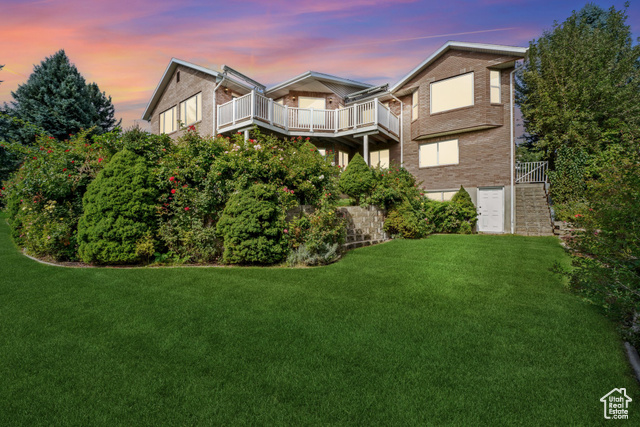 The back view of this beautiful home showcases the large windows and 5200 square feet with a full daylight ADU!