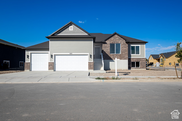 View of front of property featuring a garage