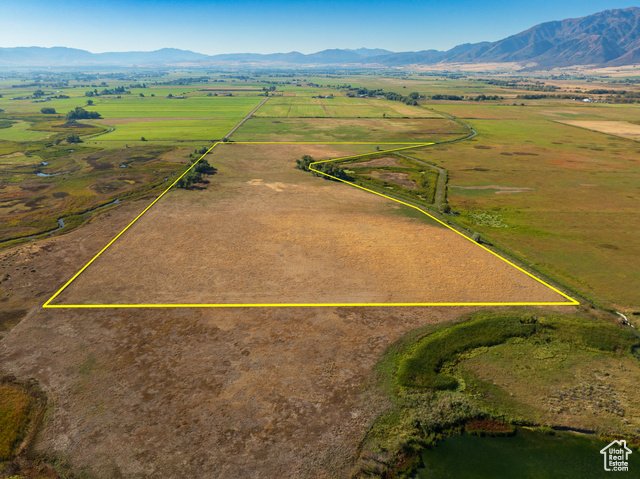 Birds eye view of property with a mountain view and a rural view