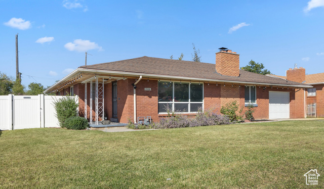 Front view with attached single car garage