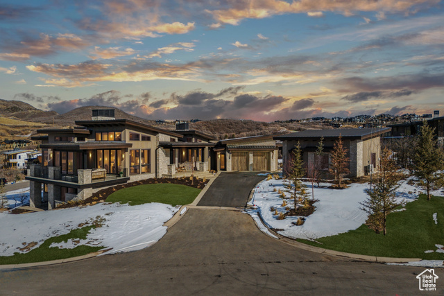 View of front facade featuring a mountain view and a yard