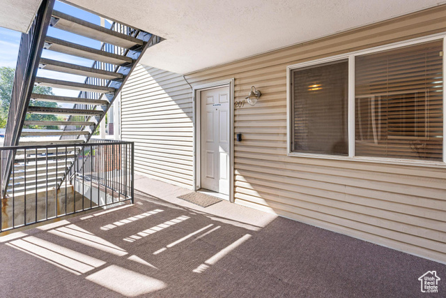 Entrance to property featuring a balcony