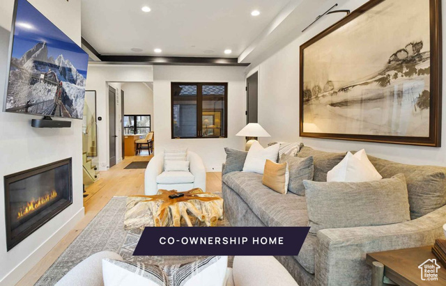 Living room with light hardwood / wood-style flooring