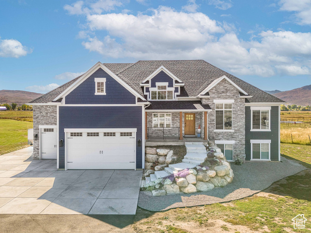 Custom built house with a mountain view and a 3 car garage