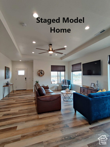 Model Home Living room featuring ceiling fan and hardwood / wood-style flooring