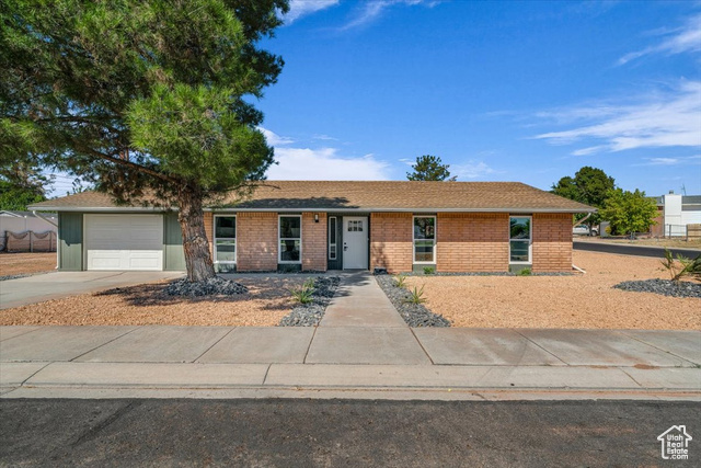 Single story home with a garage