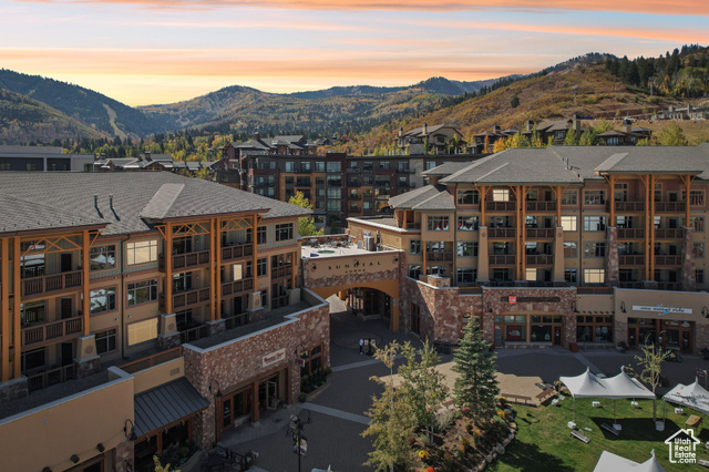 Aerial view at dusk featuring a mountain view