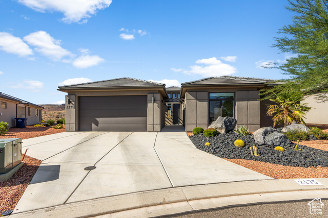 Prairie-style home featuring a garage