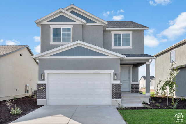 Craftsman-style home with a garage