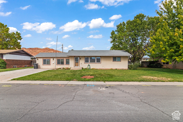 Single story home with a front yard