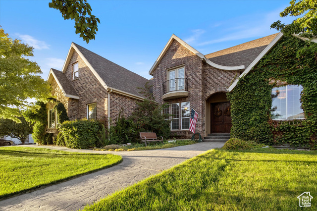 Tudor house featuring a front yard