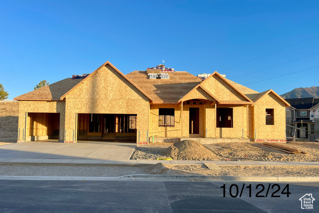 Property under construction featuring a garage