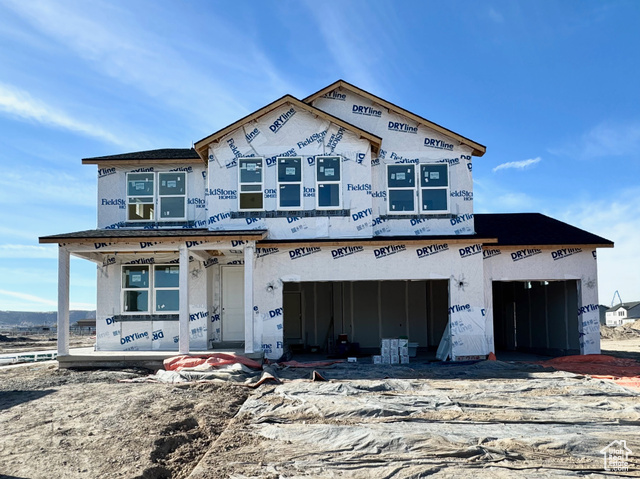 Property in mid-construction featuring a garage