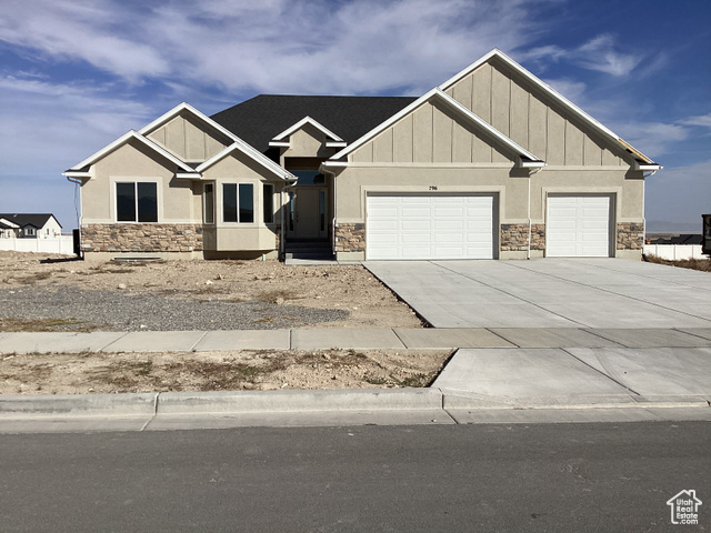 Craftsman-style home featuring a garage