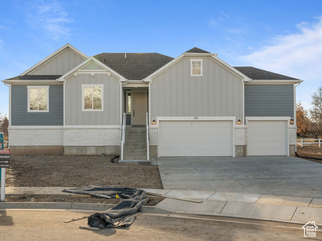 View of front facade featuring a garage