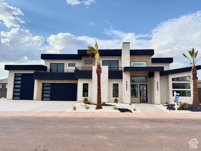 View of front facade featuring a garage