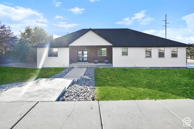 View of front of house with a front yard