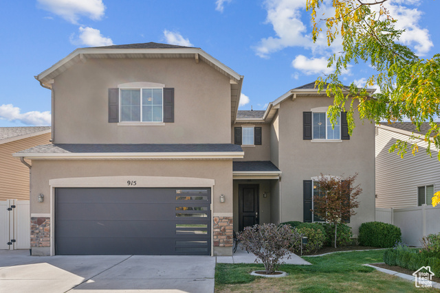 Lovely 2 Story curb appeal with modern garage door.