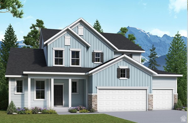 View of front facade featuring a front yard, a mountain view, and a garage