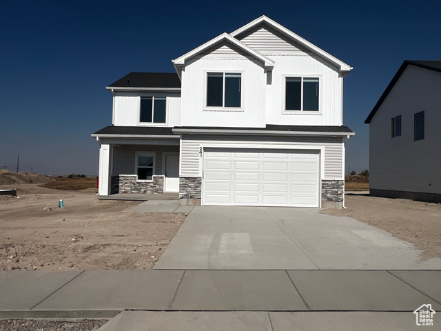 View of front of house with a garage