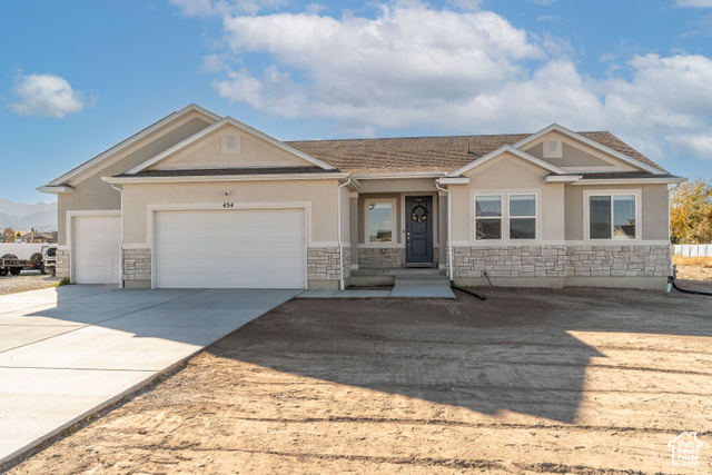 View of front of home featuring a garage