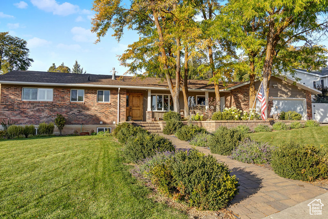 Executive home with mature trees and landscaping.